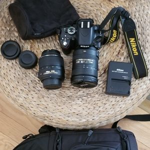 Nikon D5100 Camera with 2 lenses and Lowepro Sling Camera bag